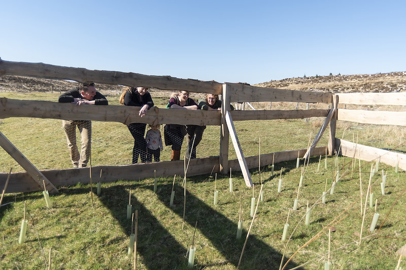 Megan Potter, Davie and Libby Logan and James Nairne looking at a newly constructed and planted seed island next to the River Snizort, Uigshader Living Forest Project, Isle of Skye, April 2025